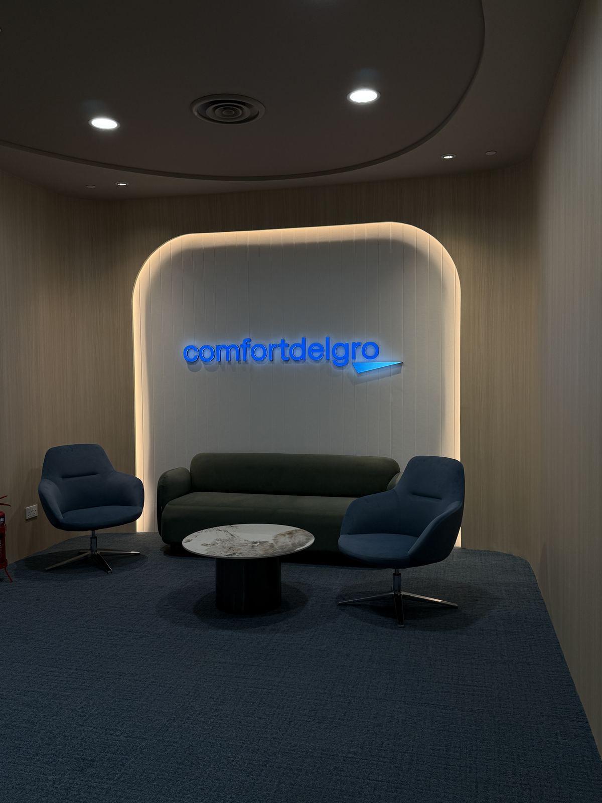 ComfortDelGro &mdash; front-lit arch logo · lounge