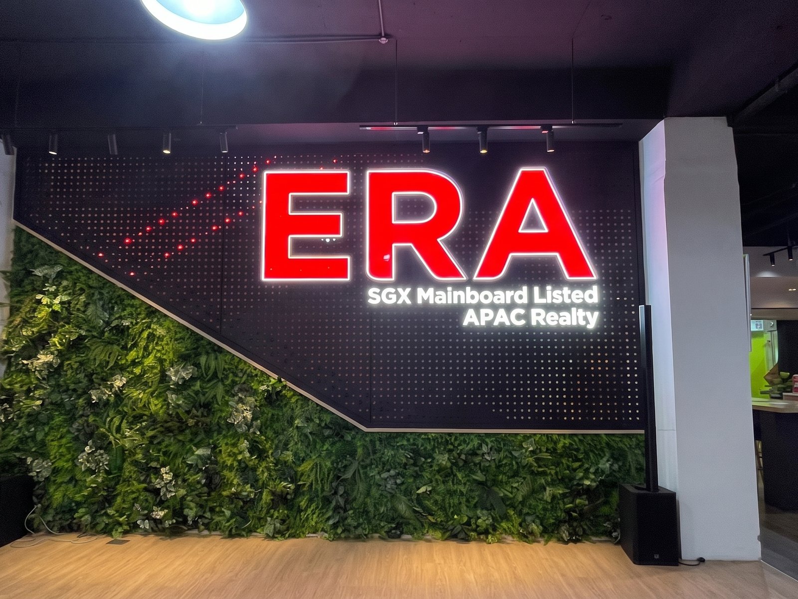 ERA · APAC Realty &mdash; illuminated letters · green wall
