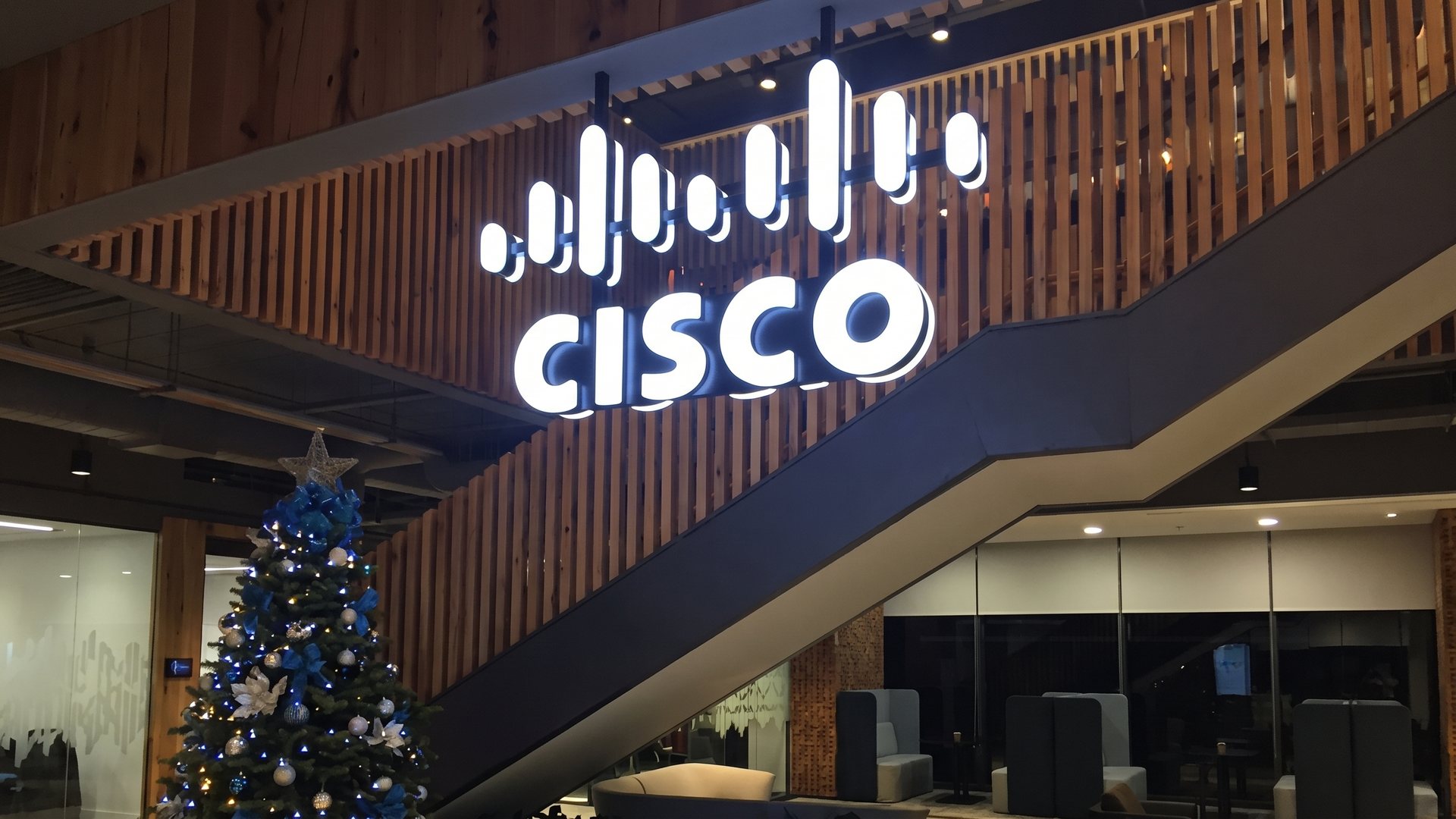 Cisco illuminated logo and lettering on timber wall
