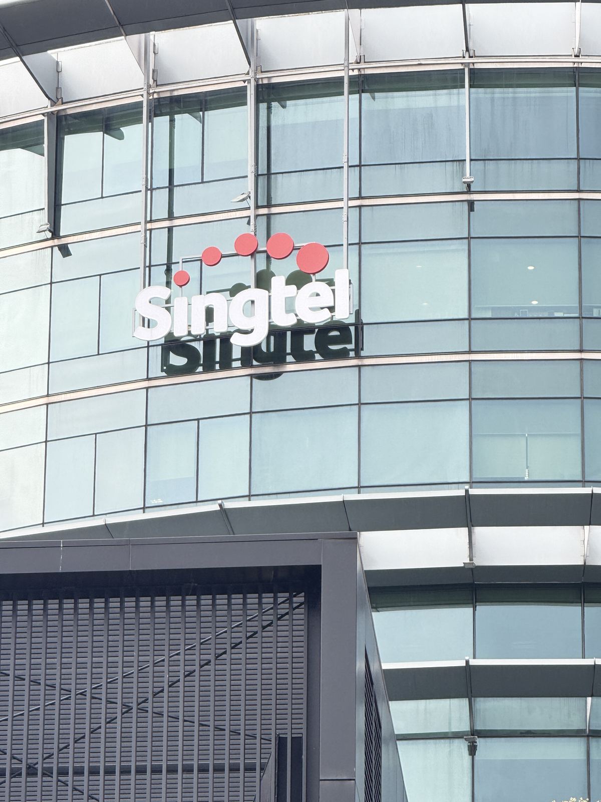 Singtel &mdash; exterior lettering · glass facade